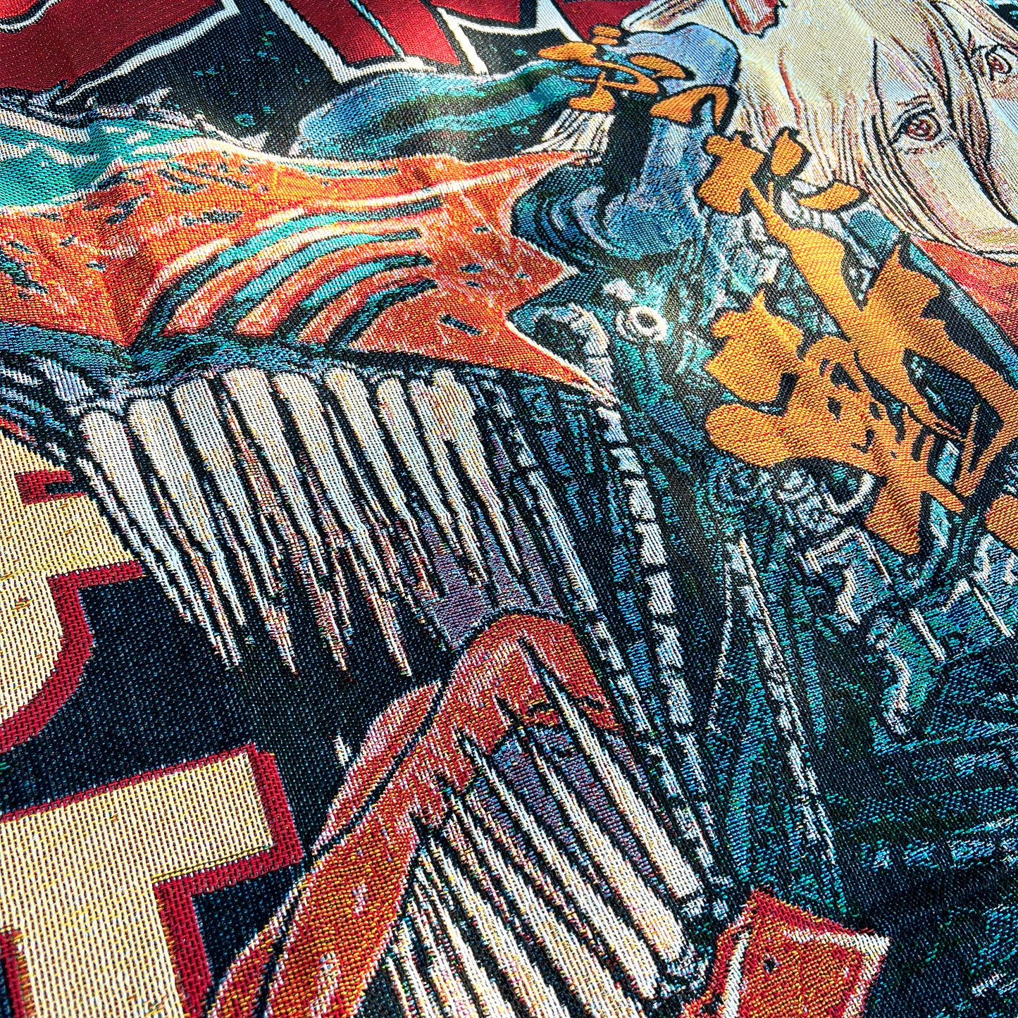 Close-up side view of a Chainsaw Man tapestry highlighting intricate details and the dramatic textures of the anime-inspired art.