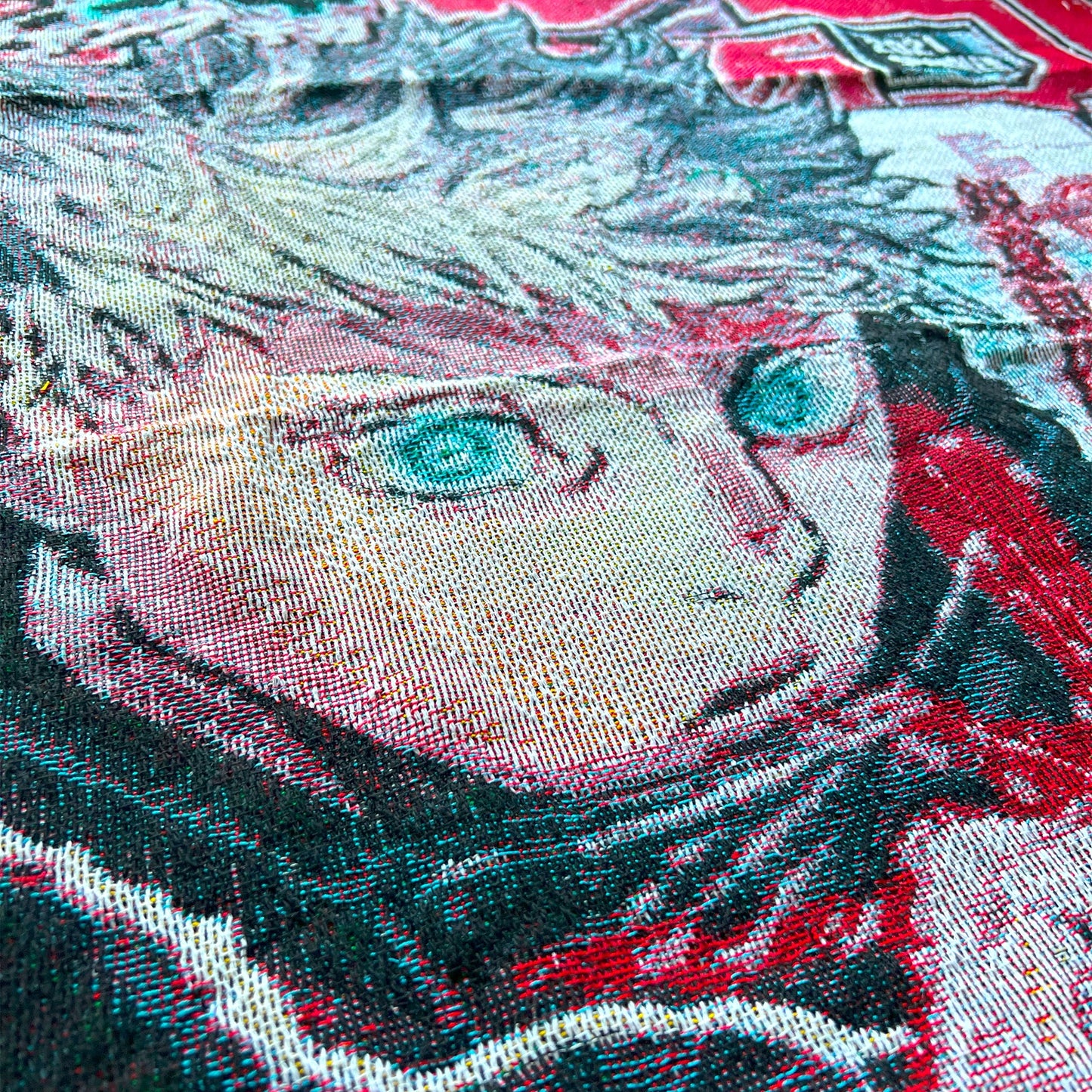 Extreme close-up of a Jujutsu Kaisen tapestry showing the finely woven texture and vivid details of Gojo Satoru’s anime artwork.