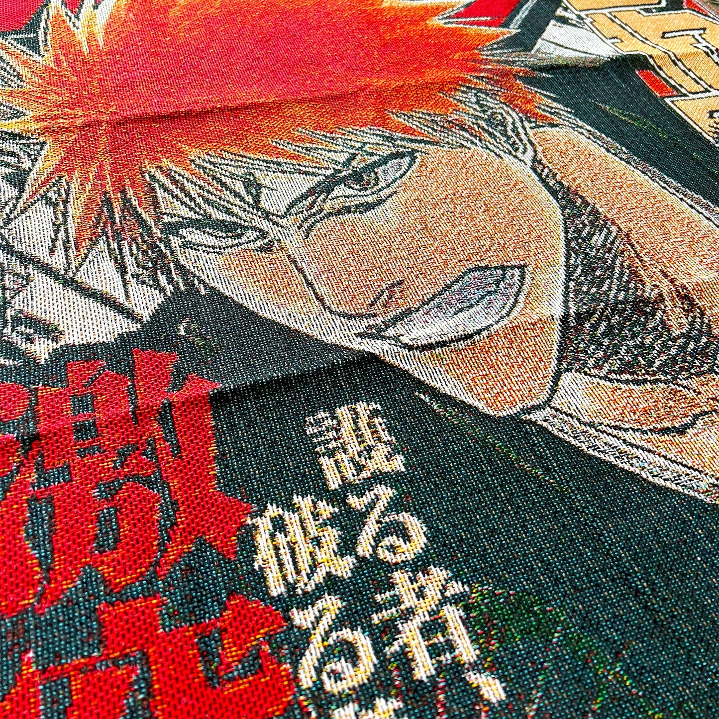 Extreme close-up of a Bleach tapestry showing the fine woven texture and sharp details of Ichigo Kurosaki and Grimmjow Jaegerjaquez in battle.