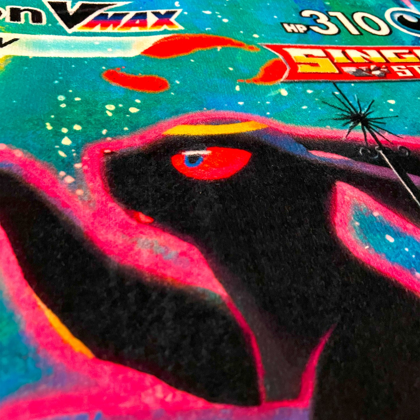 Close-up side view of an Umbreon rug highlighting the sharp printed artwork and deep, rich tones of the Pokemon design.