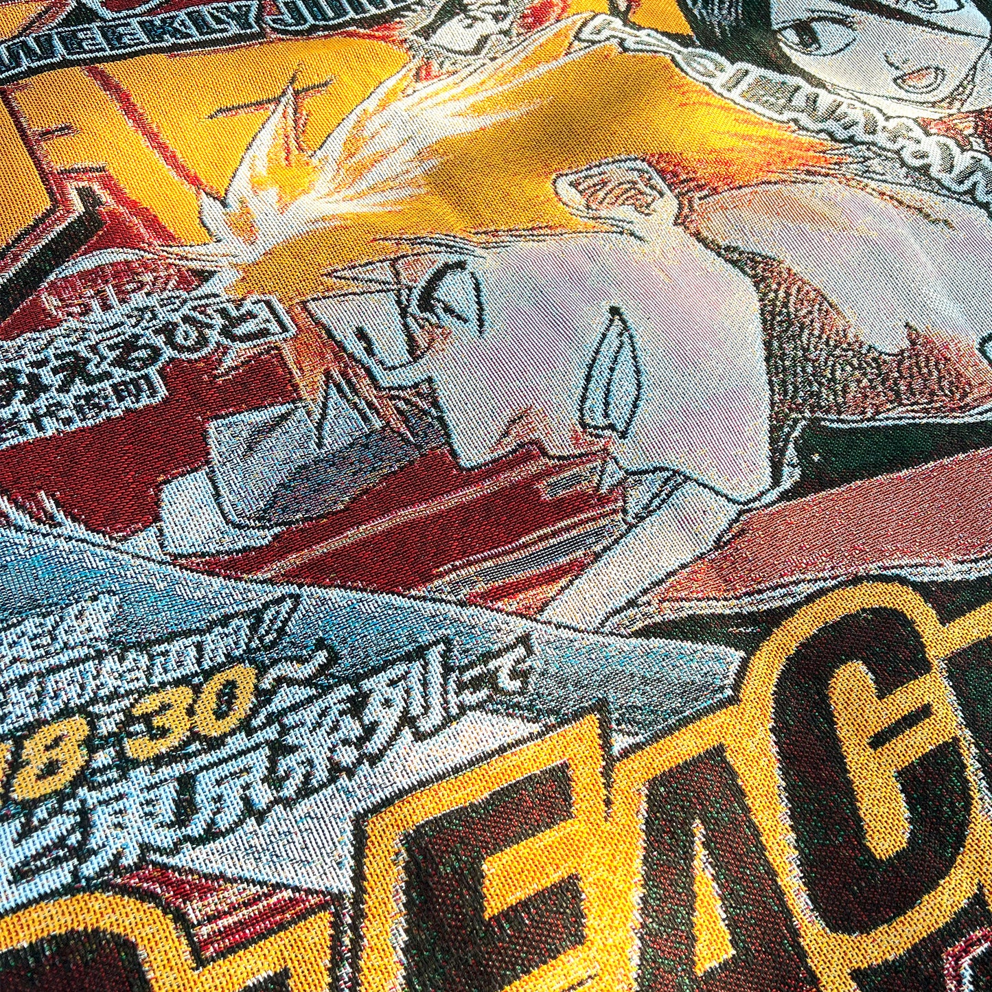 Close-up side view of a Bleach tapestry highlighting the intricate details of Ichigo and Rukia’s designs and the vivid colors of the artwork.