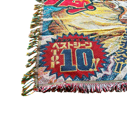 Close-up of a Dragon Ball Z blanket with a hand lifting the corner, highlighting the plush texture and premium craftsmanship.