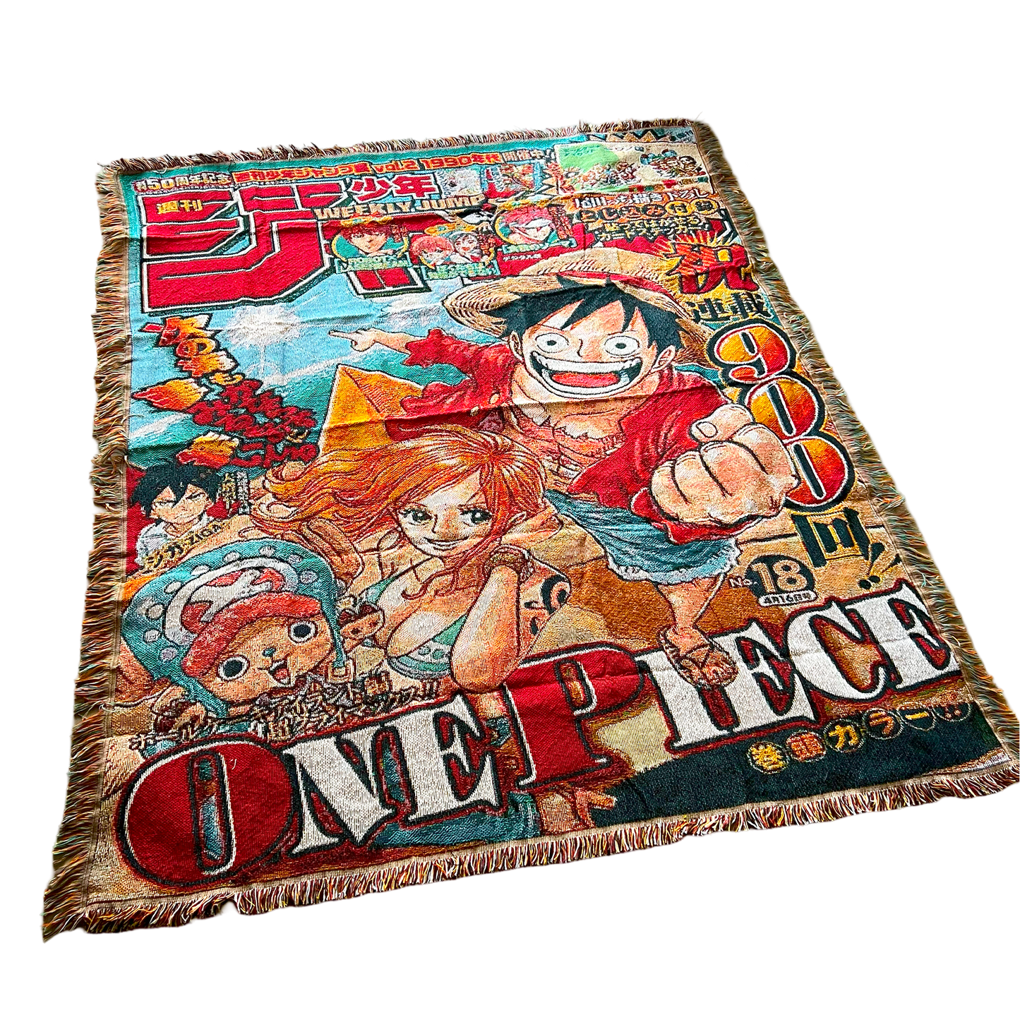 Slight side view of a One Piece tapestry showcasing bold colors, intricate details, and high-quality woven fabric.